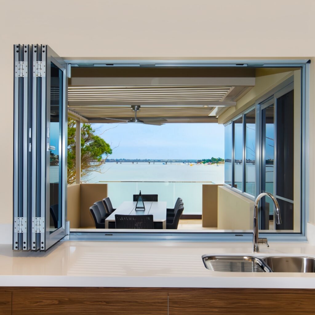 Modern white interior bifold doors neatly folded open to reveal a well-organized closet space.